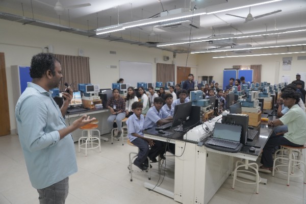 Students attending a workshop briefing in the Electrical Engineering laboratory